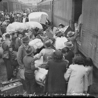 Boarding trains for Manzanar Relocation Center