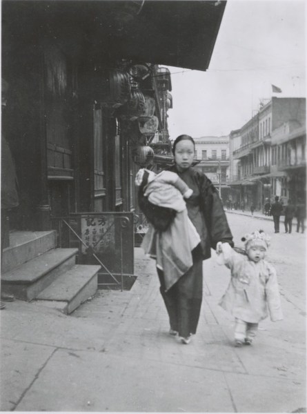 Mother Walking with two children