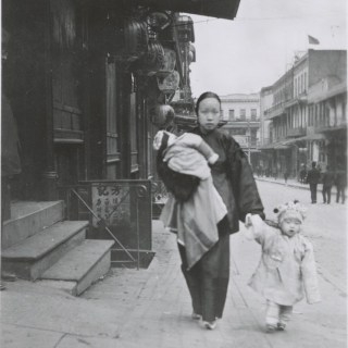Mother Walking with two children